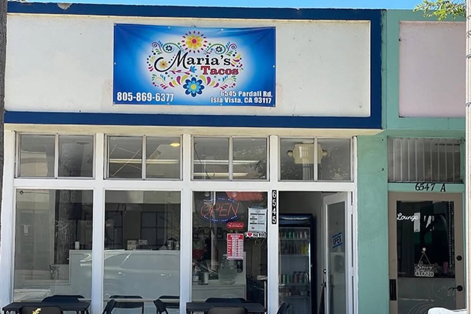 The Maria's Tacos storefront at 6545 Pardall Rd in Isla Vista, with the door open and tables out front